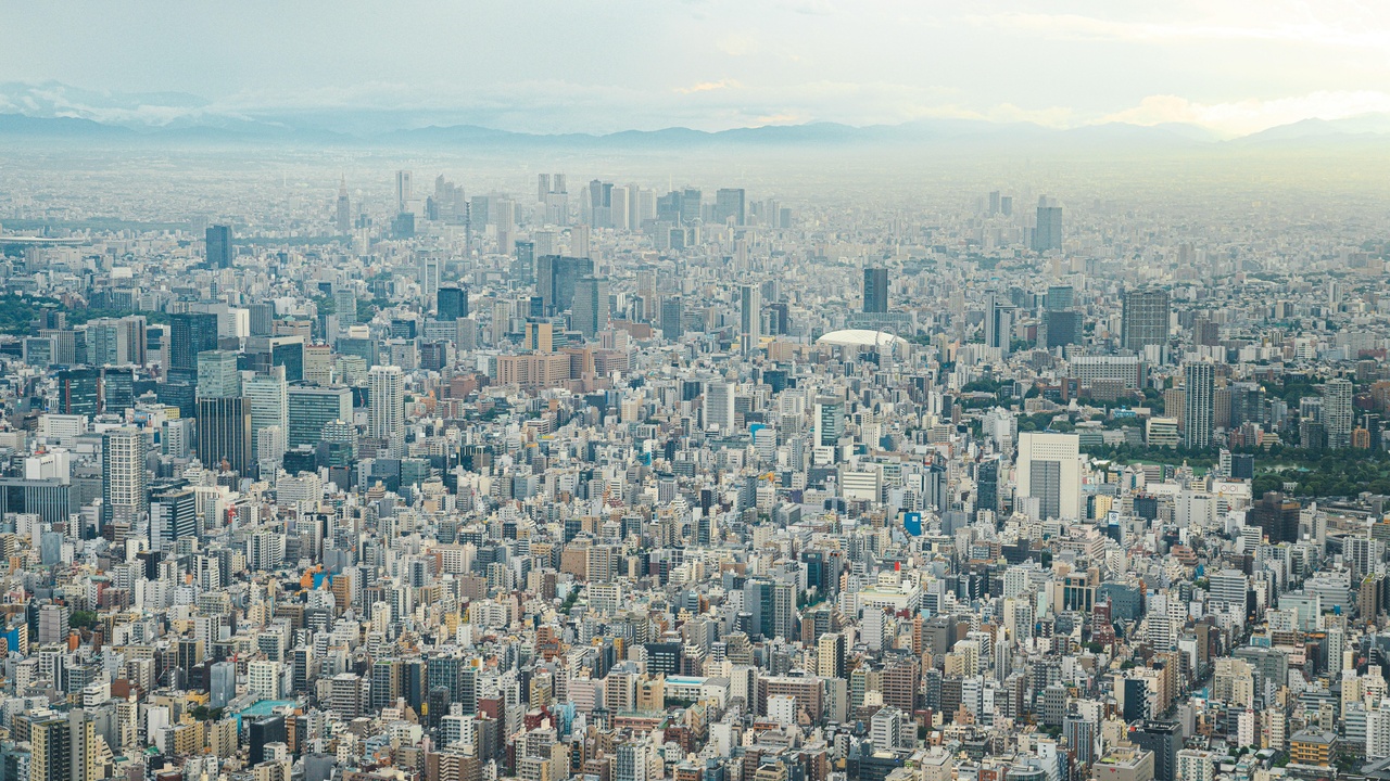 View of Tokyo skyline from an observation deck at sunset