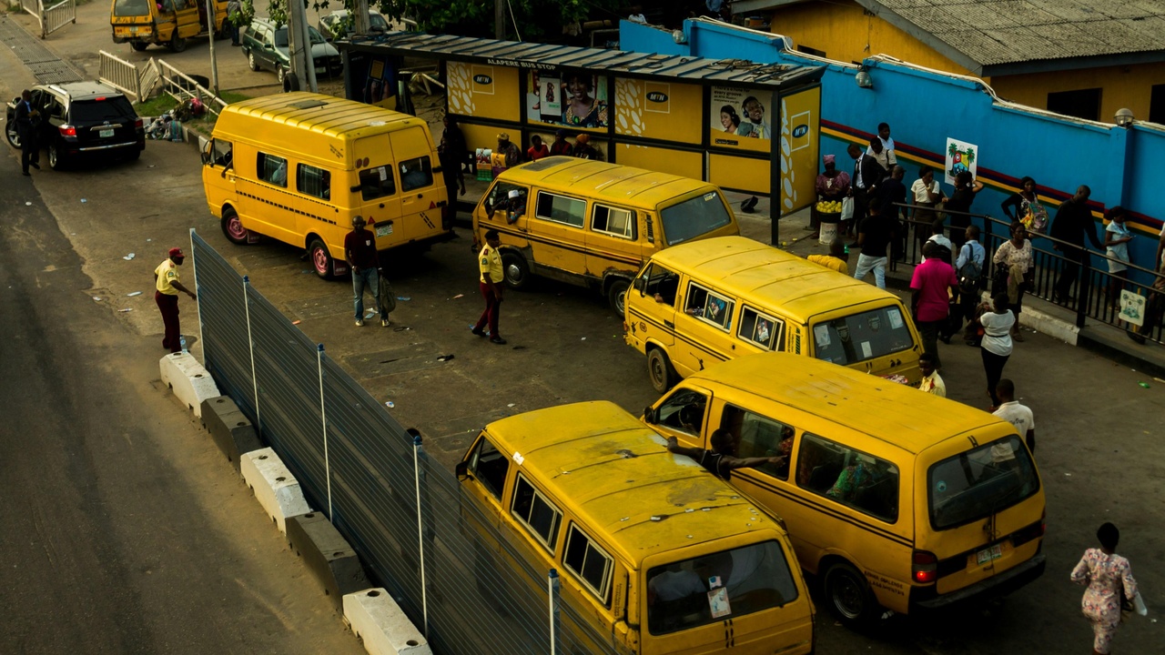 Modern clinic and busy urban transit in Nigeria showing improving services and connectivity