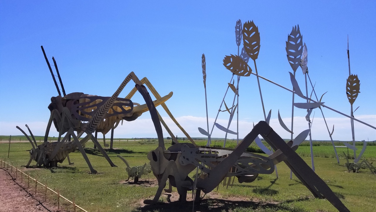 Large steel roadside sculptures on the Enchanted Highway with open prairie