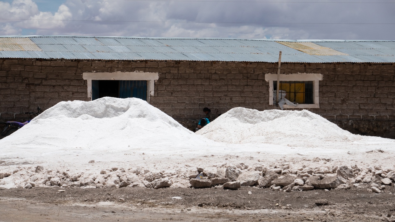 Panoramic view of Bolivia landscapes including salt flat and high Andes.