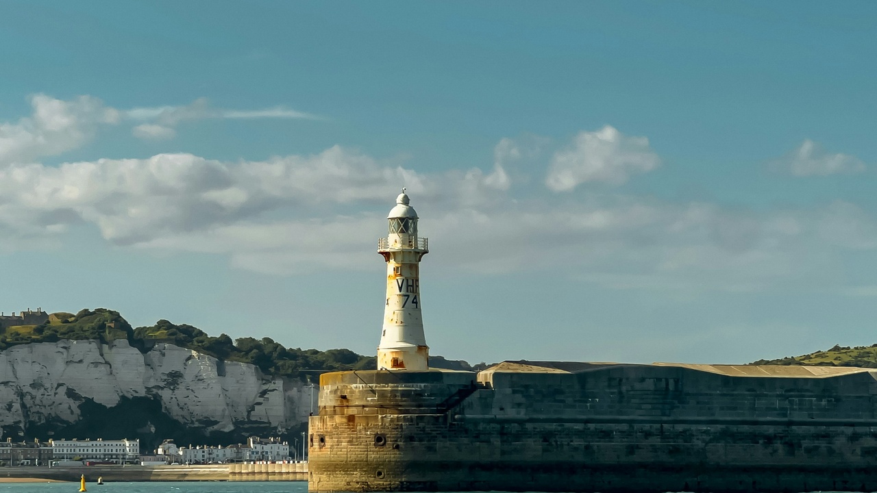 Boats in Dover harbour with the cliffs in the background