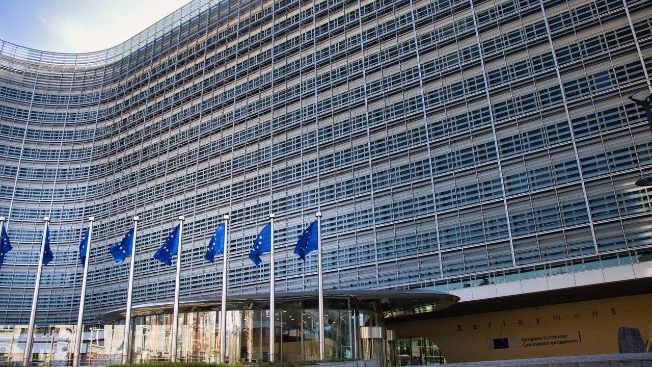 EU and NATO buildings in Brussels skyline with flags