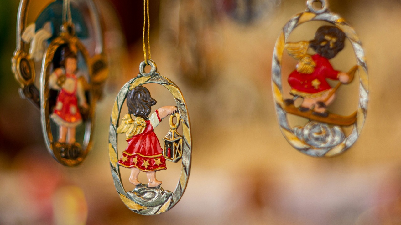 Nuremberg Christmas market stalls with lights and Glühwein cups