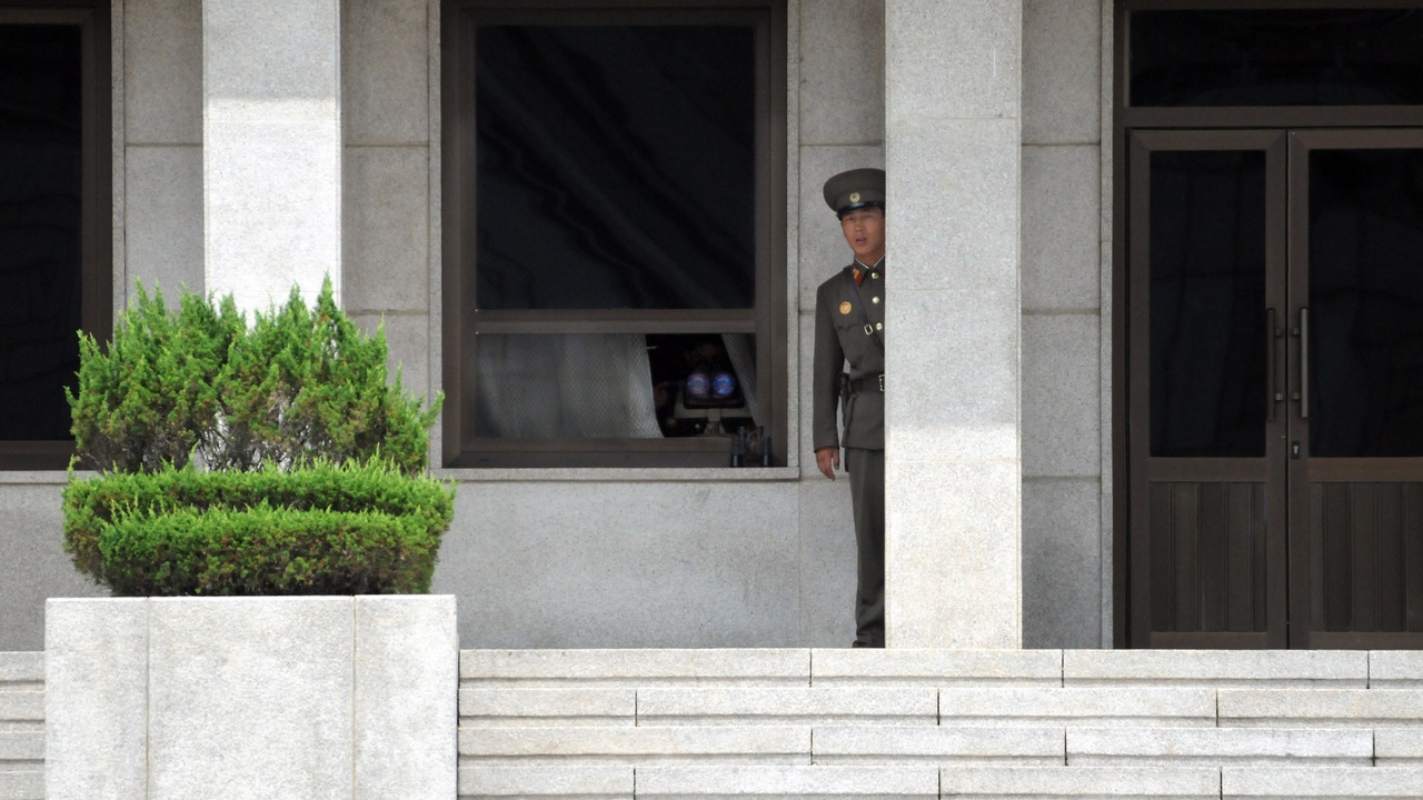 Paraglider launching over East Coast with ocean below