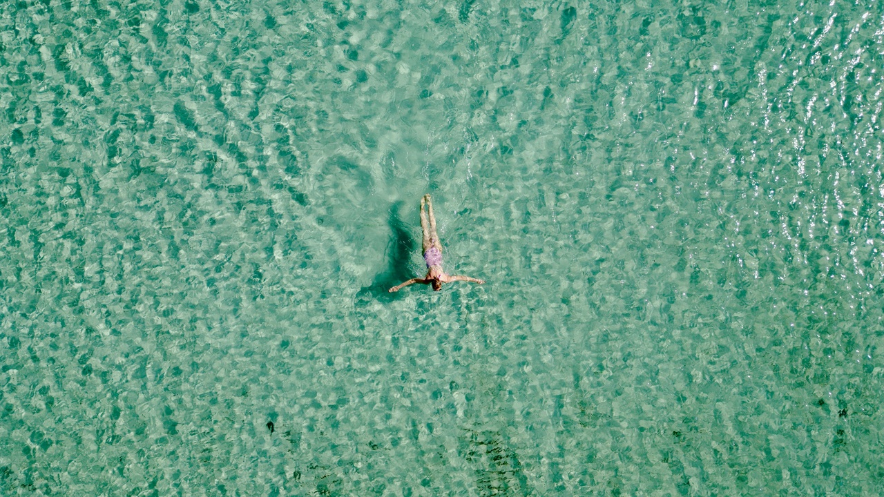 Kayaks passing mangrove-lined channel at Caladesi Island State Park