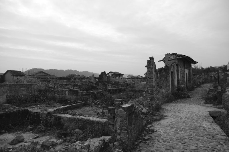 Explore the haunting beauty of an abandoned town in black and white.