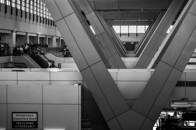 Black and white view of structural beams at an airport terminal in Pasay, Philippines.