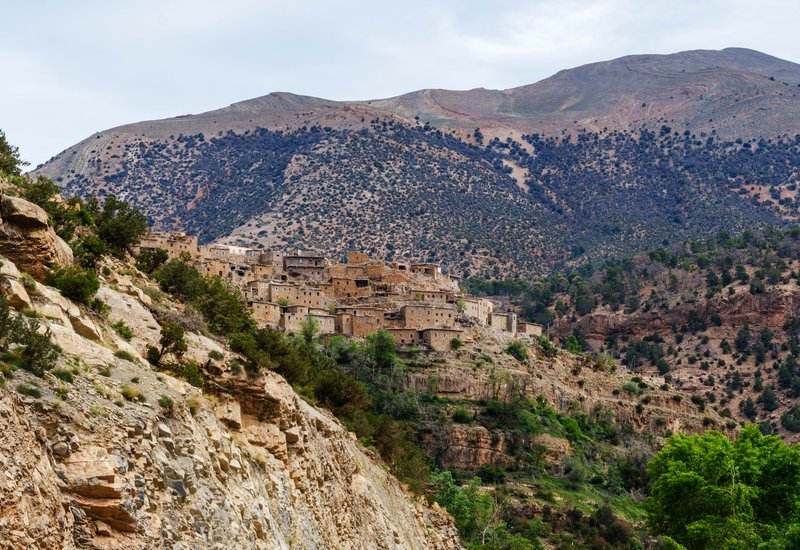 Picturesque view of a historic village nestled in the Moroccan Atlas Mountains.