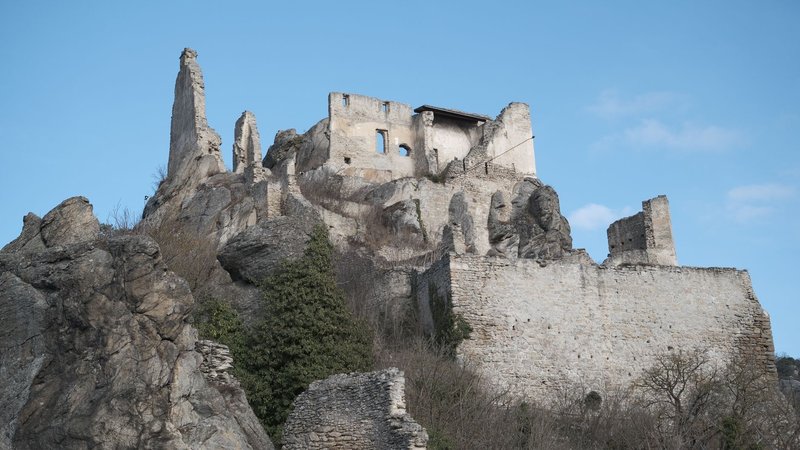 Explore the stunning ruins of Dürnstein Castle set against a clear blue sky.