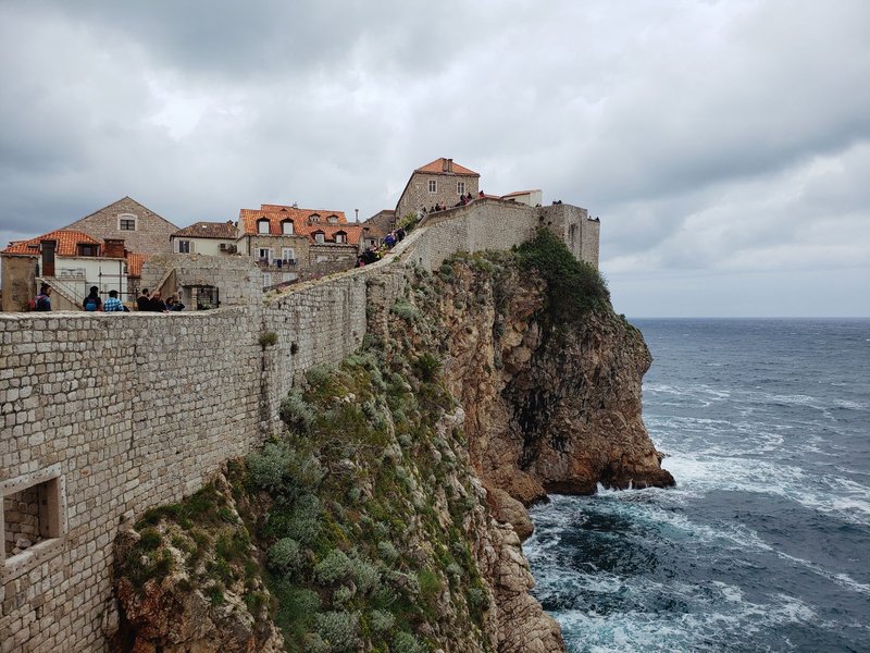 Breathtaking view of Dubrovnik's historic city walls perched above the Adriatic Sea.