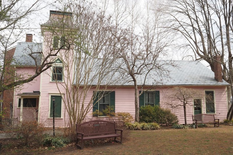 Charming pink house with green shutters in Lambertville, New Jersey.