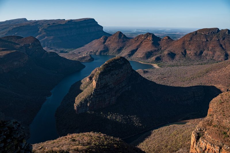 Stunning aerial view of Blyde River Canyon, with scenic rock formations and winding river.