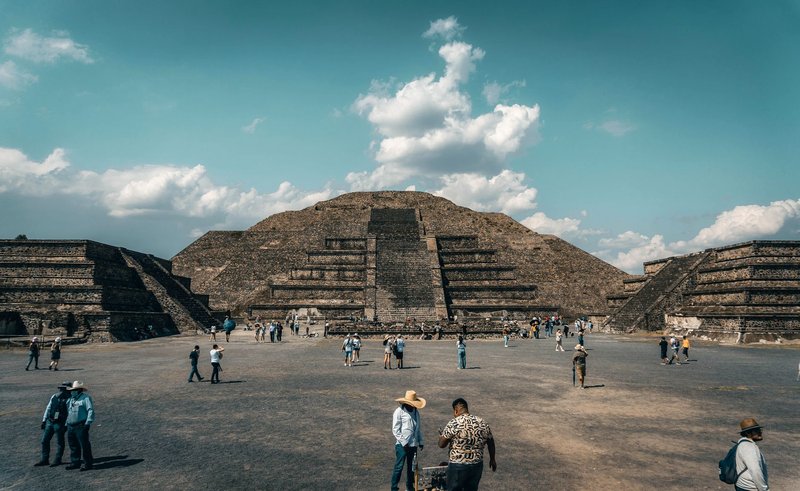 Explore the iconic Pyramid of the Sun in Teotihuacan, Mexico, bustling with visitors.
