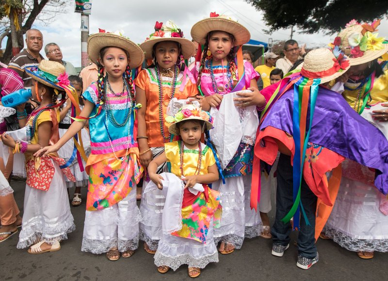 Colorful traditional costumes worn by children during a festival in Diriamba, Nicaragua.