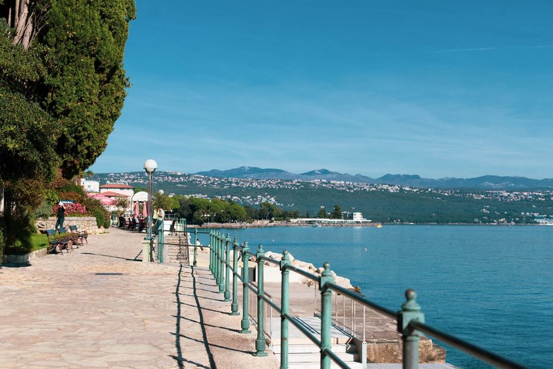 Explore the beautiful Adriatic coastline from the promenade in Opatija, Croatia featuring a summer seaside view.