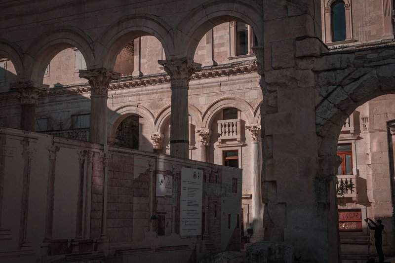 Archways in Split's historic site, showcasing Roman architecture and cultural heritage.