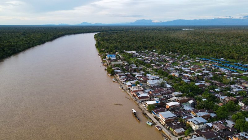Stunning aerial shot of Vigia Del Fuerte, showcasing the riverfront and lush landscape.