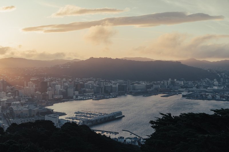 Breathtaking aerial view of Wellington, New Zealand at sunset showcasing the city and waterfront.
