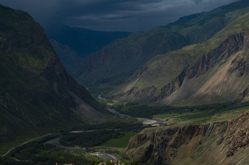 Explore the dramatic landscapes and deep valleys of the Altai Mountains in this breathtaking nature photograph.