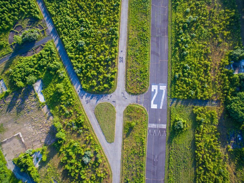 Aerial photo of an abandoned runway surrounded by greenery in Marlboro, NJ.