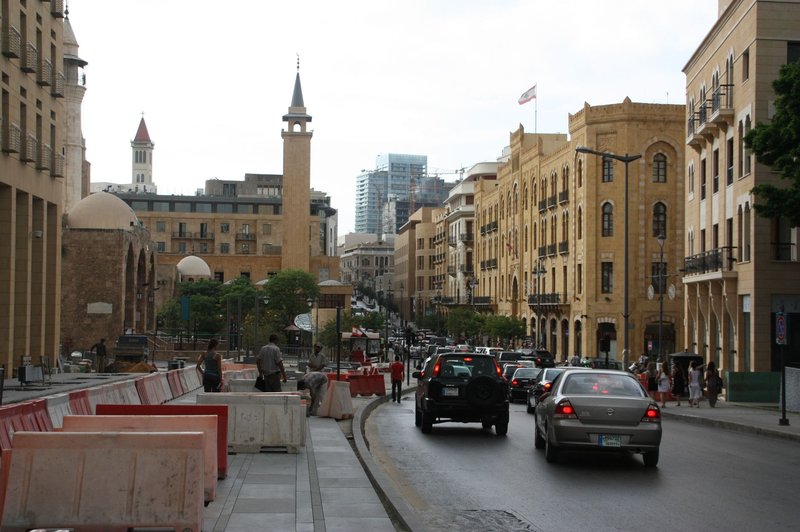 Bustling street scene in downtown Beirut with historic architecture and traffic.