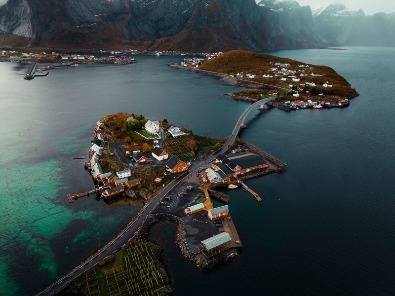 A breathtaking aerial view of the Lofoten Islands in Norway, showcasing scenic coastlines and charming villages.
