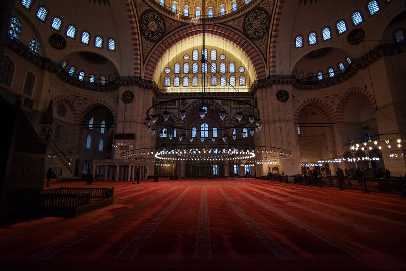 Majestic interior view of the historic Süleymaniye Mosque in Istanbul, showcasing its stunning architecture.