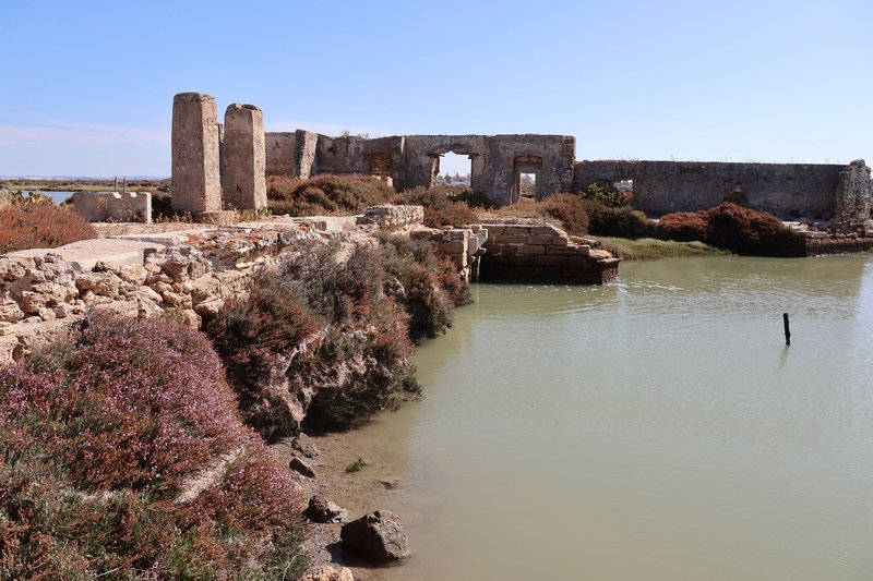 Explore the ruins of an ancient mill in the serene landscape of San Fernando, Spain.
