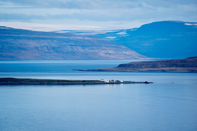A stunning view of Westfjords in Iceland showcasing mountains and water, captured from above.