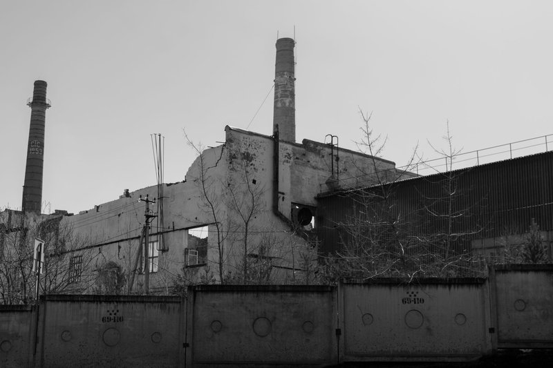 Black and white photo of a deserted factory in Irbit, Russia, showcasing decay.