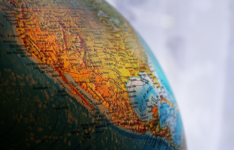 Close-up of a globe highlighting North America, showcasing geography and cartography details.