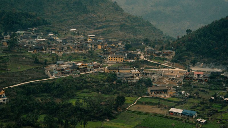 Scenic aerial view of a rural mountain village in Ha Giang, Vietnam.