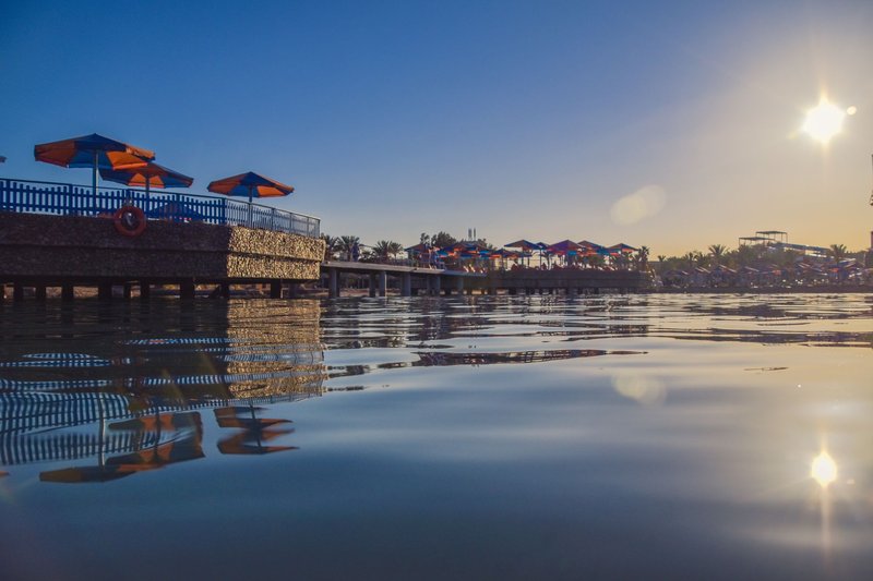 Glorious view of Hurgada's waterfront with sunsetting and reflections on calm sea.