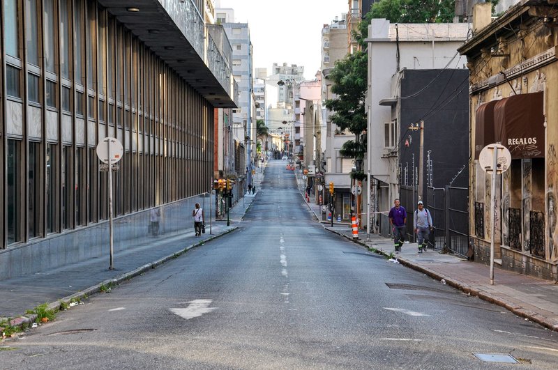A tranquil urban street in Montevideo, Uruguay, showcasing architecture and daily life.